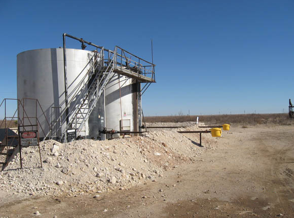 Image of Tank battery with caliche burm and above ground load line containment